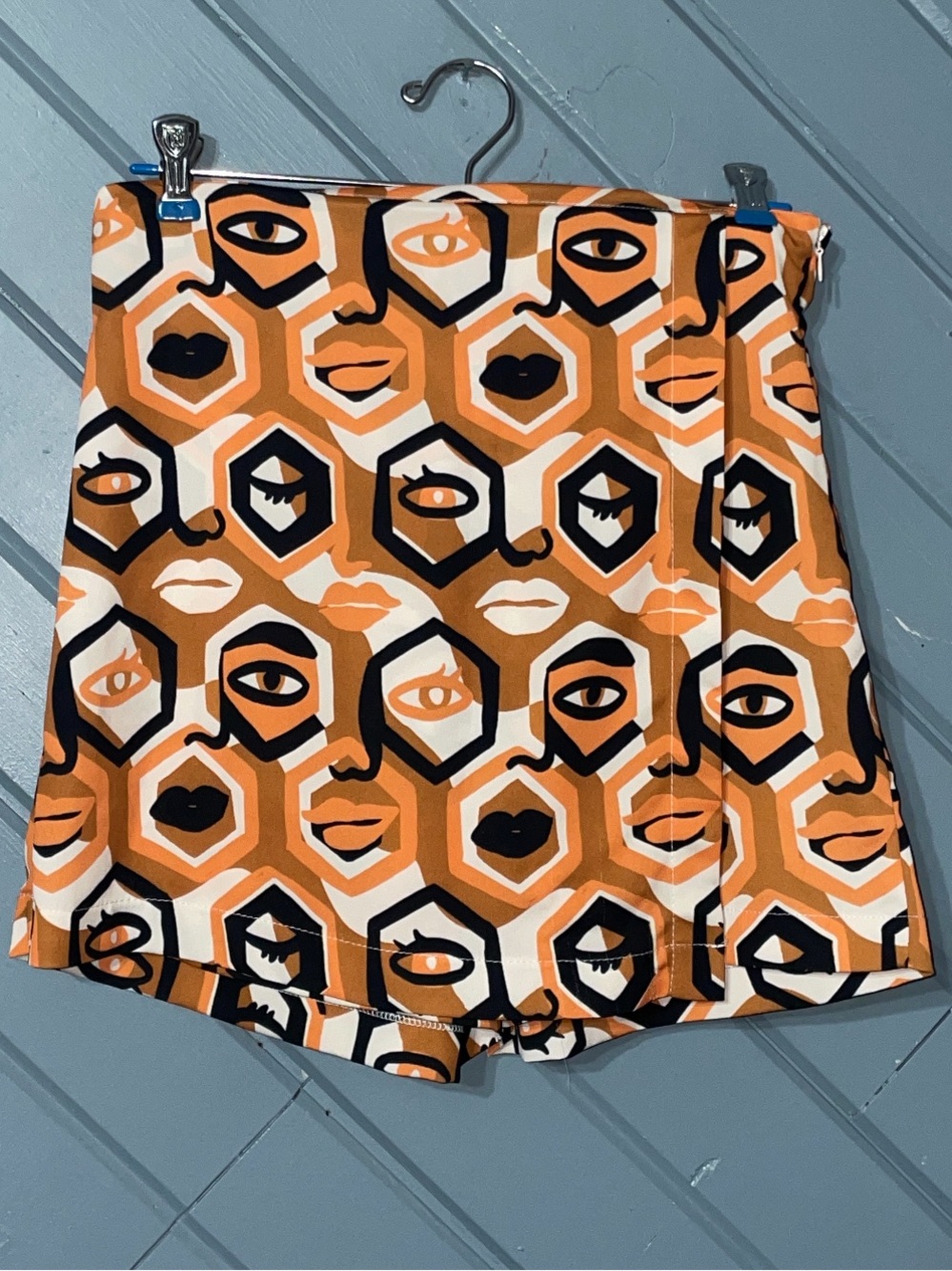 Anthropologie Dazey LA “Headspace” abstract faces orange black white skort